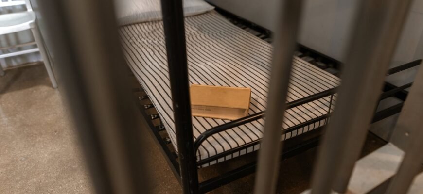 brown wooden box on a striped foam mattress