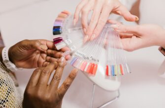 a client choosing on a nail color palette