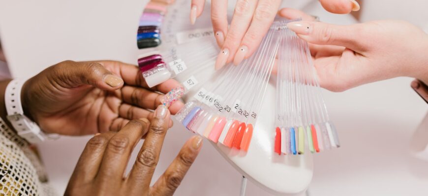 a client choosing on a nail color palette