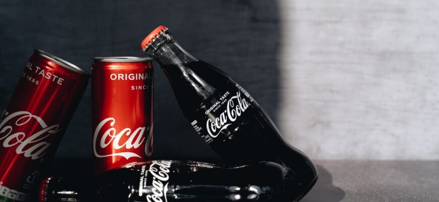 close up photo of canned and bottled soft drinks