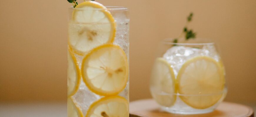 glasses with lemon drink on table