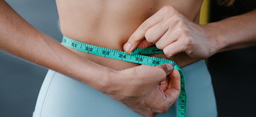 woman measuring her abdo