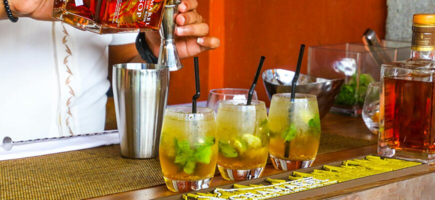 person preparing rum drink