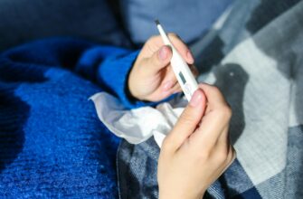 person holding thermometer