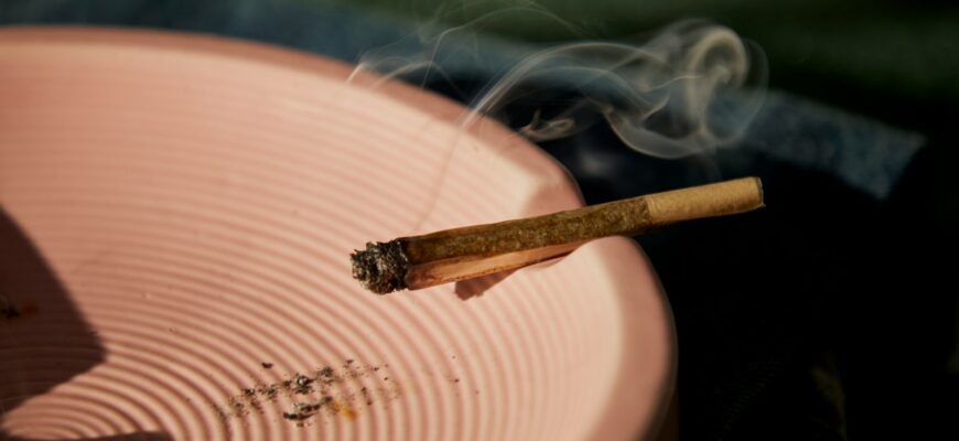 a close up of a cigarette on a plate