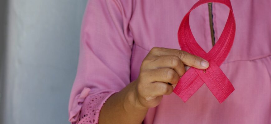woman in pink and white polka dot shirt