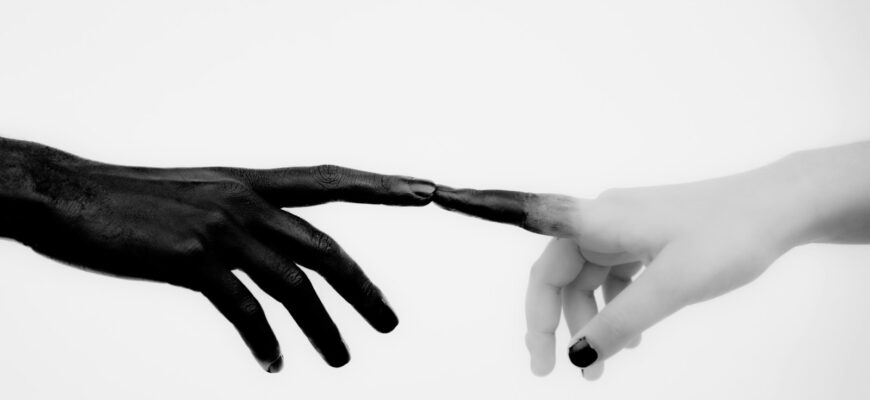 persons hand with white manicure