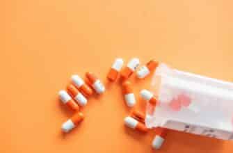 orange and white medication pill