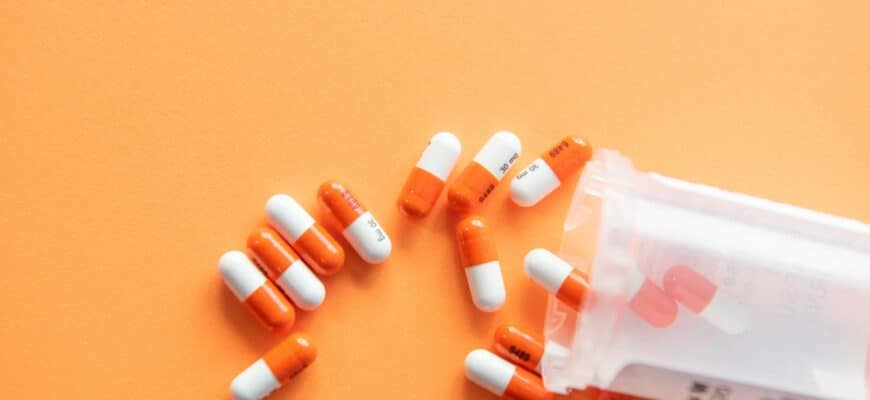 orange and white medication pill