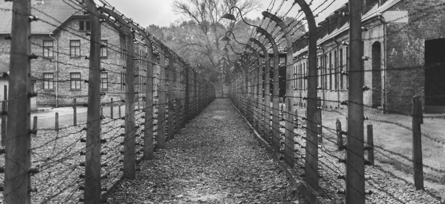 grayscale photo of metal frame glass building