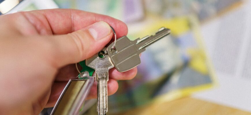 A person holding a bunch of keys in their hand