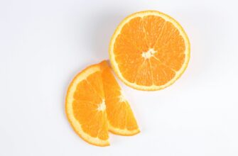 sliced orange fruit on white surface