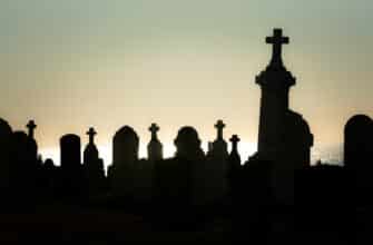 silhouette of people standing on top of building during sunset