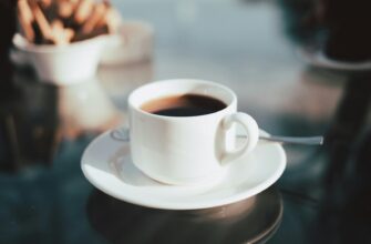 cup of coffee on white ceramic saucer