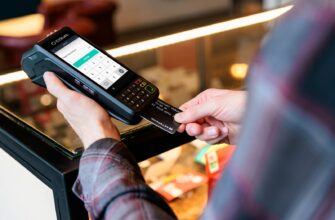 a person holding a cell phone in their hand