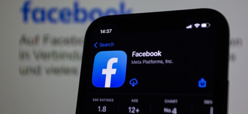 a close up of a cell phone with facebook on the screen