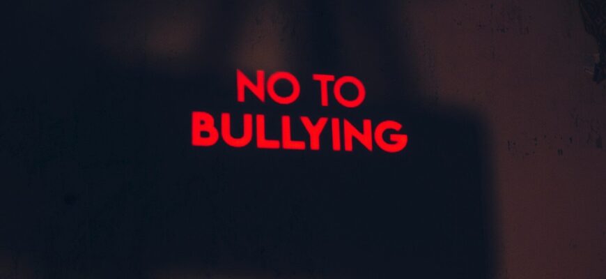 a red sign that says no to bullying