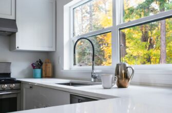 a kitchen with a sink, stove and a window