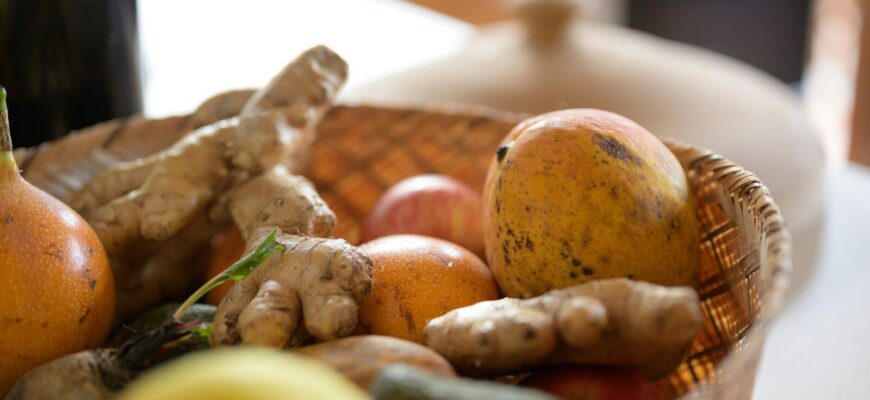 green and brown fruits on brown woven basket