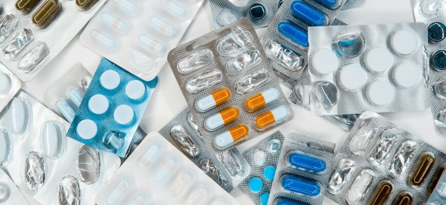 a pile of pills sitting next to each other on top of a table