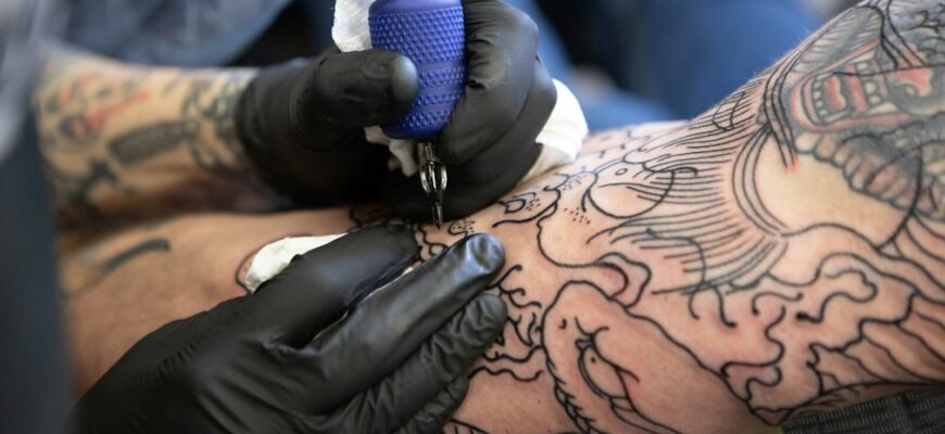 person with tattoo on right arm