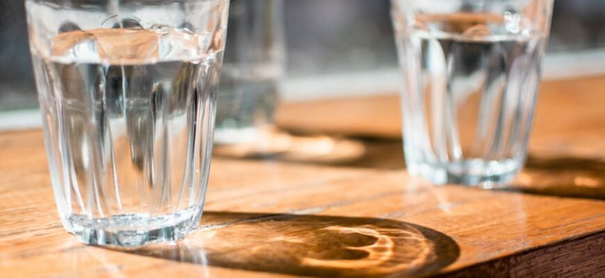 three clear drinking glass on table
