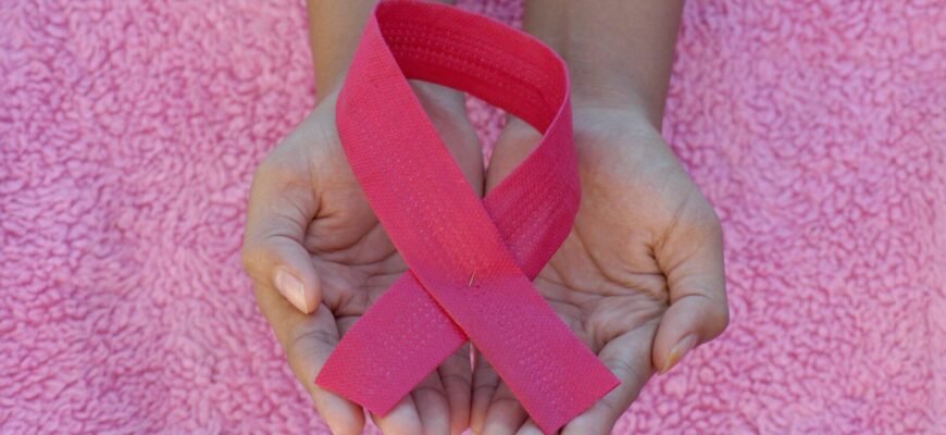 person with pink band on her left hand
